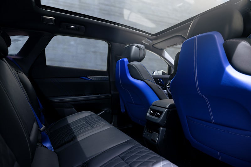 Back Seat View of the 2026 OPTIQ-V Blue Front Seats, Sun Roof, and Interior | Wilkinson Cadillac in Sanford NC